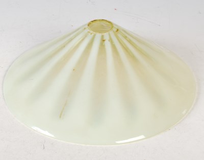 Lot 412 - A Vaseline glass conical form lamp shade, 26.5...