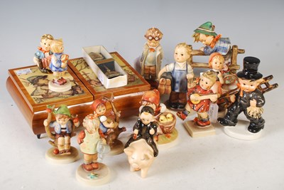 Lot 415 - A collection of Hummel figures by Goebbel to...