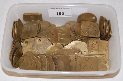 Lot 185 - A box of assorted vintage brass miner's tokens.