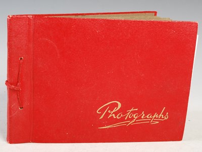 Lot 54 - A red-coloured vintage photograph album...