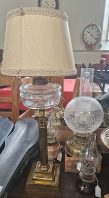 Lot 502 - A late 19th/early 20th century paraffin lamp...