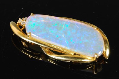 Lot 70 - A yellow metal mounted opal and diamond set...