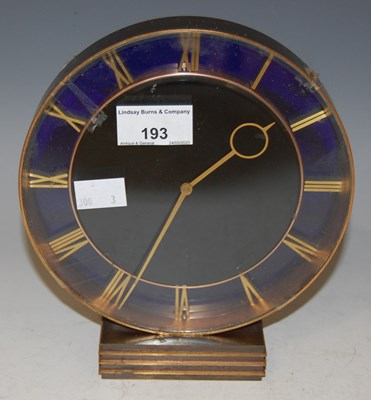 Lot 193 - An Art Deco blue glass and brass circular...