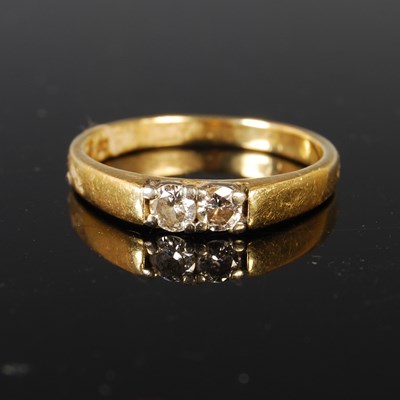 Lot 83 - An 18ct gold and diamond two-stone ring, size '...