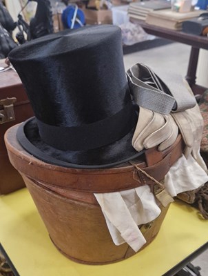 Lot 549 - An Antique leather cased top hat, by R. W....