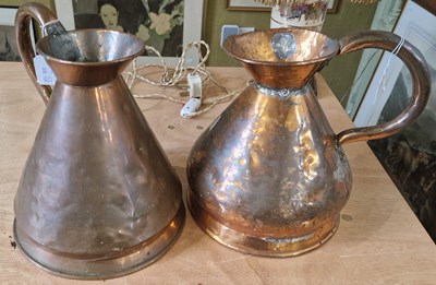 Lot 561 - Two Antique copper galleon measuring jugs.