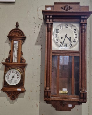 Lot 689 - A carved wood mercury Aneroid barometer, with...