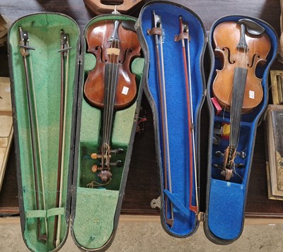 Lot 690 - An Antique violin and two bows contained...