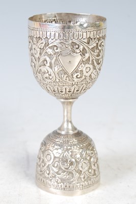 Lot 143 - An Indian white metal spirit measuring cup,...