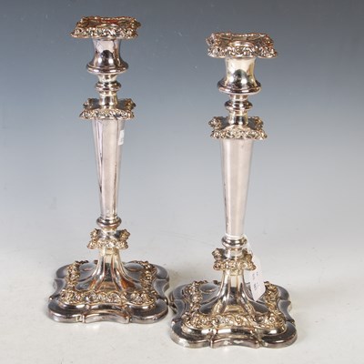 Lot 141 - A pair of Sheffield plate candlesticks with...