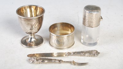 Lot 145 - A collection of silverware to include egg cup;...