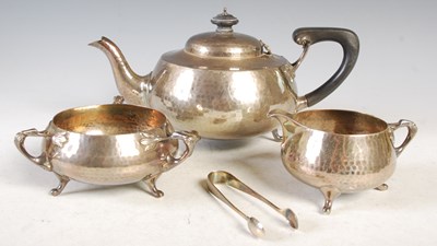 Lot 142 - A London silver four-piece tea set comprising...