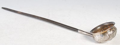 Lot 169 - An antique white metal mounted toddy ladle...