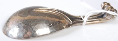 Lot 174 - A silver caddy spoon, London 1938, maker's...