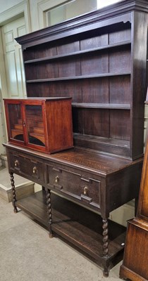 Lot 717 - An early 20th century oak two-part dresser,...