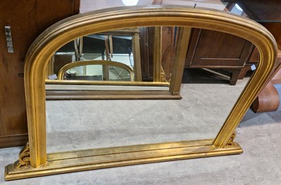 Lot 723 - A 20th century gilt arched overmantle mirror...