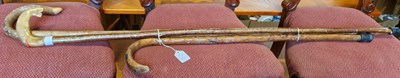 Lot 727 - Three assorted wooden walking canes, to...