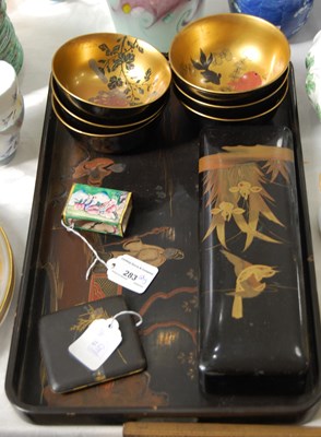 Lot 283 - A small collection of Japanese lacquered items...