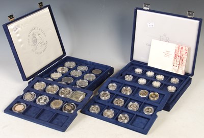 Lot 237 - Two blue velvet coin cases containing part...