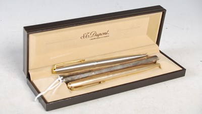 Lot 266 - A white metal cased fountain pen by Dupont,...