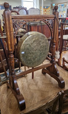 Lot 769 - An Antique oak framed brass dinner gong and...