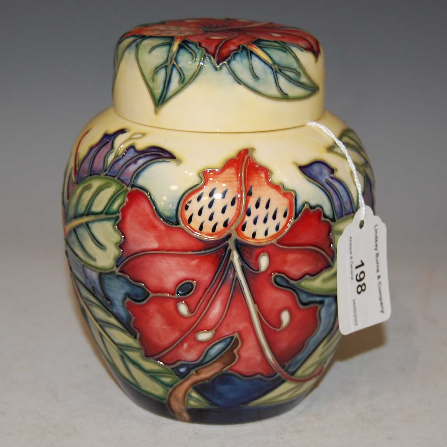 Lot 198 - A Moorcroft pottery yellow ground jar and...