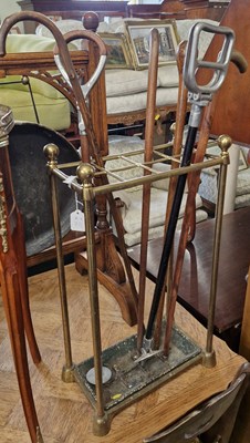 Lot 776 - An Antique brass eight division stick stand...