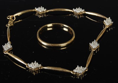 Lot 286 - A yellow metal and diamond chip bracelet...