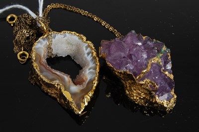 Lot 287A - Two yellow metal mounted quartz/agate pendants...