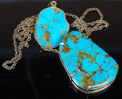 Lot 292 - A 9ct gold mounted turquoise pendant suspended...