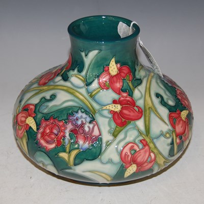 Lot 200 - A Moorcroft pottery green ground vase,...