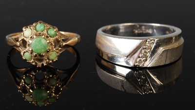 Lot 301 - A 9ct gold dress ring with green cabochon...