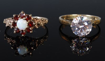 Lot 303 - Two dress rings to include a white metal opal...