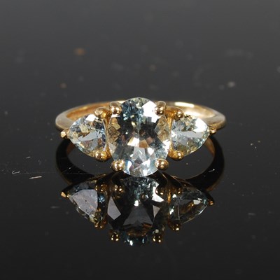 Lot 311 - A 9ct gold QVC three stone aquamarine coloured...