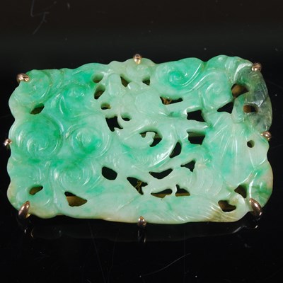 Lot 315 - A yellow metal mounted jade brooch, carved and...