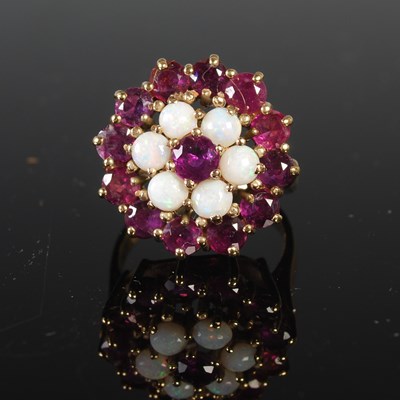 Lot 318 - A yellow metal opal and garnet cluster ring,...