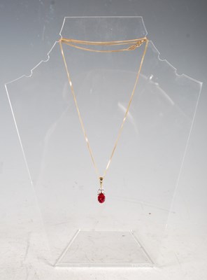 Lot 321 - A 9ct gold necklace suspending yellow and...