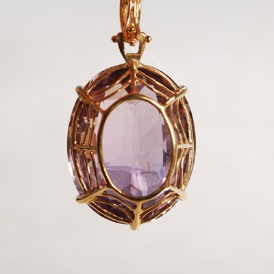 Lot 322 - A 9ct gold necklace suspending 9ct gold...