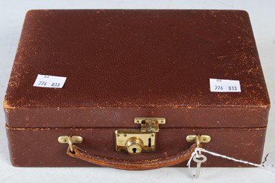 Lot 87 - A brown leather jewellery box containing a...