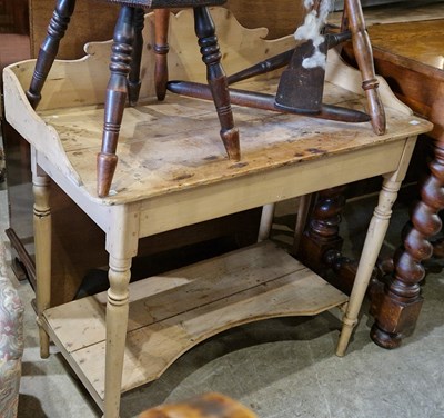 Lot 810 - An antique pine wash stand with shaped...