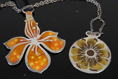 Lot 122 - Two Norman Grant silver and enamel pendants...