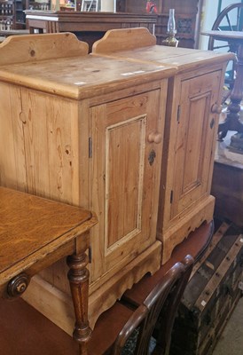 Lot 825 - A pair of 20th century pine bedside cupboards...