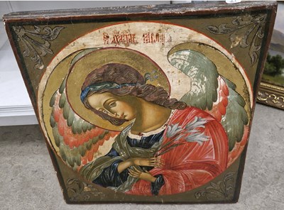 Lot 631 - An antique Russian icon colour and gilt on...