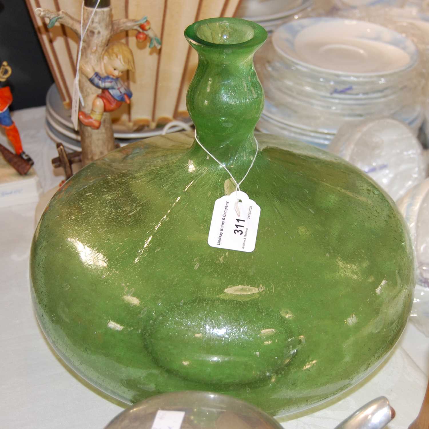 Lot 311 - A green art glass vase
