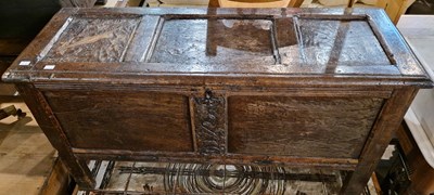 Lot 857 - An Antique oak coffer with carved floral...