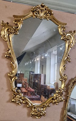 Lot 684 - A gilt framed Rococo style wall mirror, 74 cm...