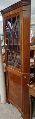 Lot 837 - An Edwardian mahogany corner cupboard, the...