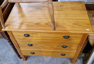 Lot 874 - A modern pine chest of three long graduated...