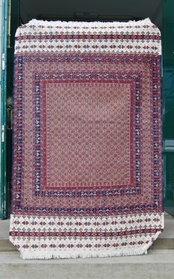 Lot 909 - A 20th century Persian flat-weave rug worked...