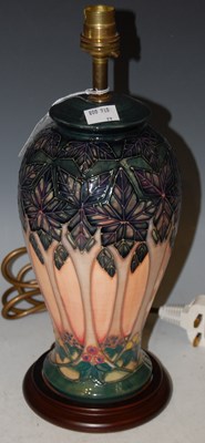 Lot 201 - A Moorcroft pottery table lamp and shade,...